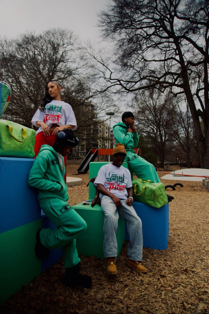 Cordial campaign models in green tracksuits and white graphic tees